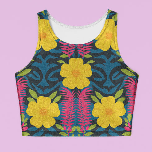Honey Dazed Brand body-hugging racerback crop top featuring retro floral print with bright yellow flowers, pink geometric patterns, and blue swirls on dark background in performance knit fabric